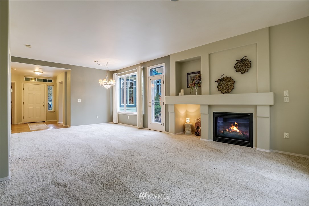 672 Chelan Place Northeast Renton, WA 98059 - Photo 7 of 24 a view of a livingroom with a fireplace and window