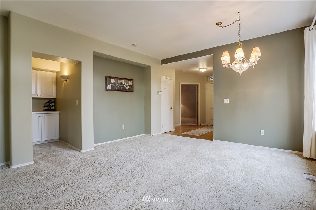 672 Chelan Place Northeast Renton, WA 98059 - Photo 8 of 24 a view of a livingroom with a chandelier