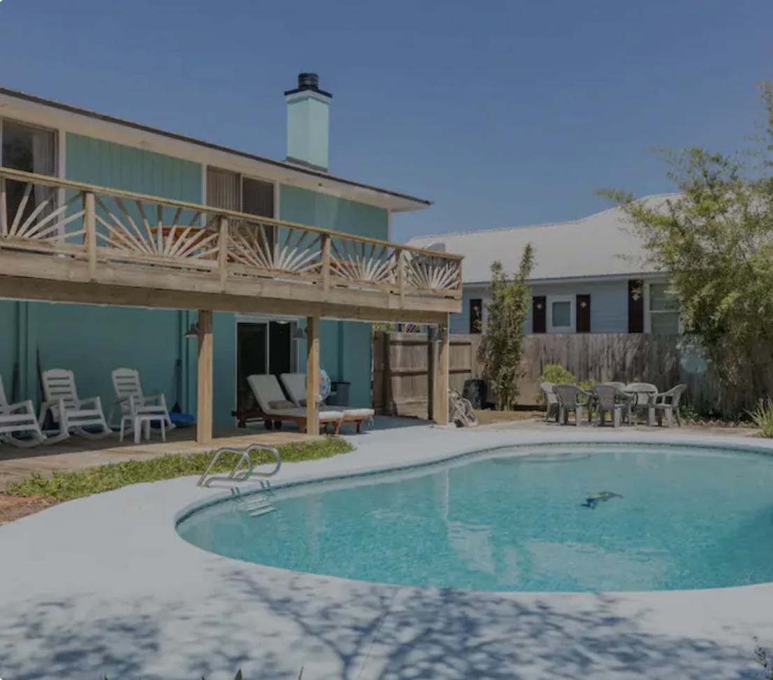 231 Treasure Beach Road St. Augustine, FL 32080 - Photo 1 of 7 a view of a house with sitting area and swimming pool