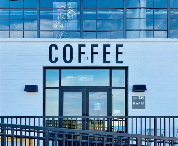 a view of a wooden door and a street sign