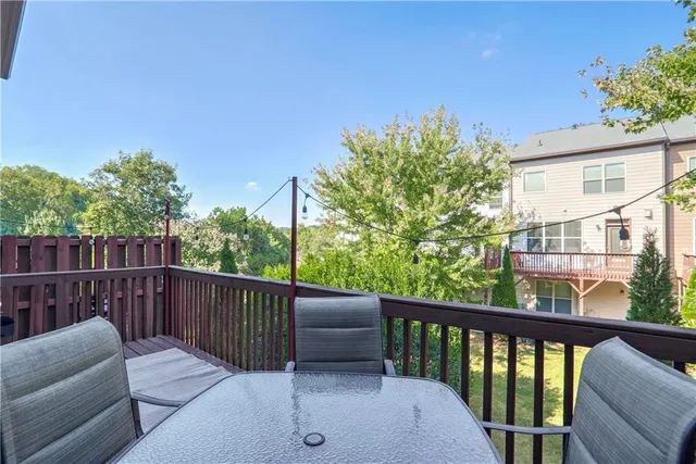 a view of roof deck with furniture