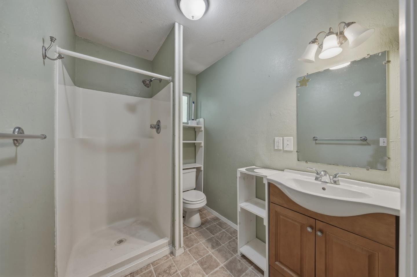 13590 Fair Oak Road Clearlake, CA 95422 - Photo 12 of 27 a bathroom with a sink a toilet and shower
