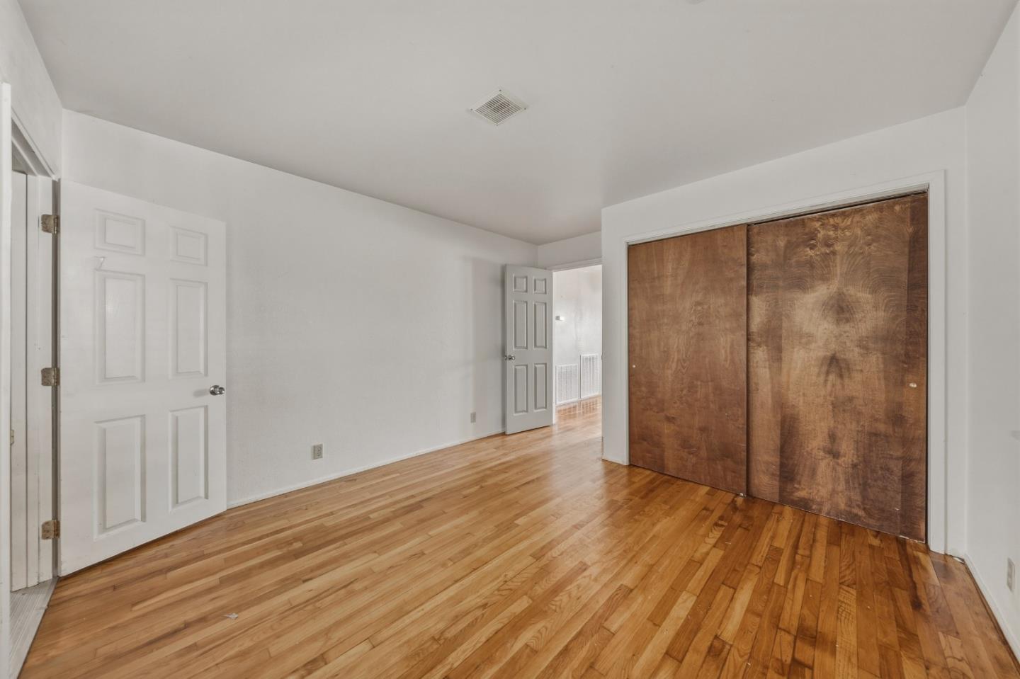 13590 Fair Oak Road Clearlake, CA 95422 - Photo 15 of 27 a view of a room with wooden floor and brick walls