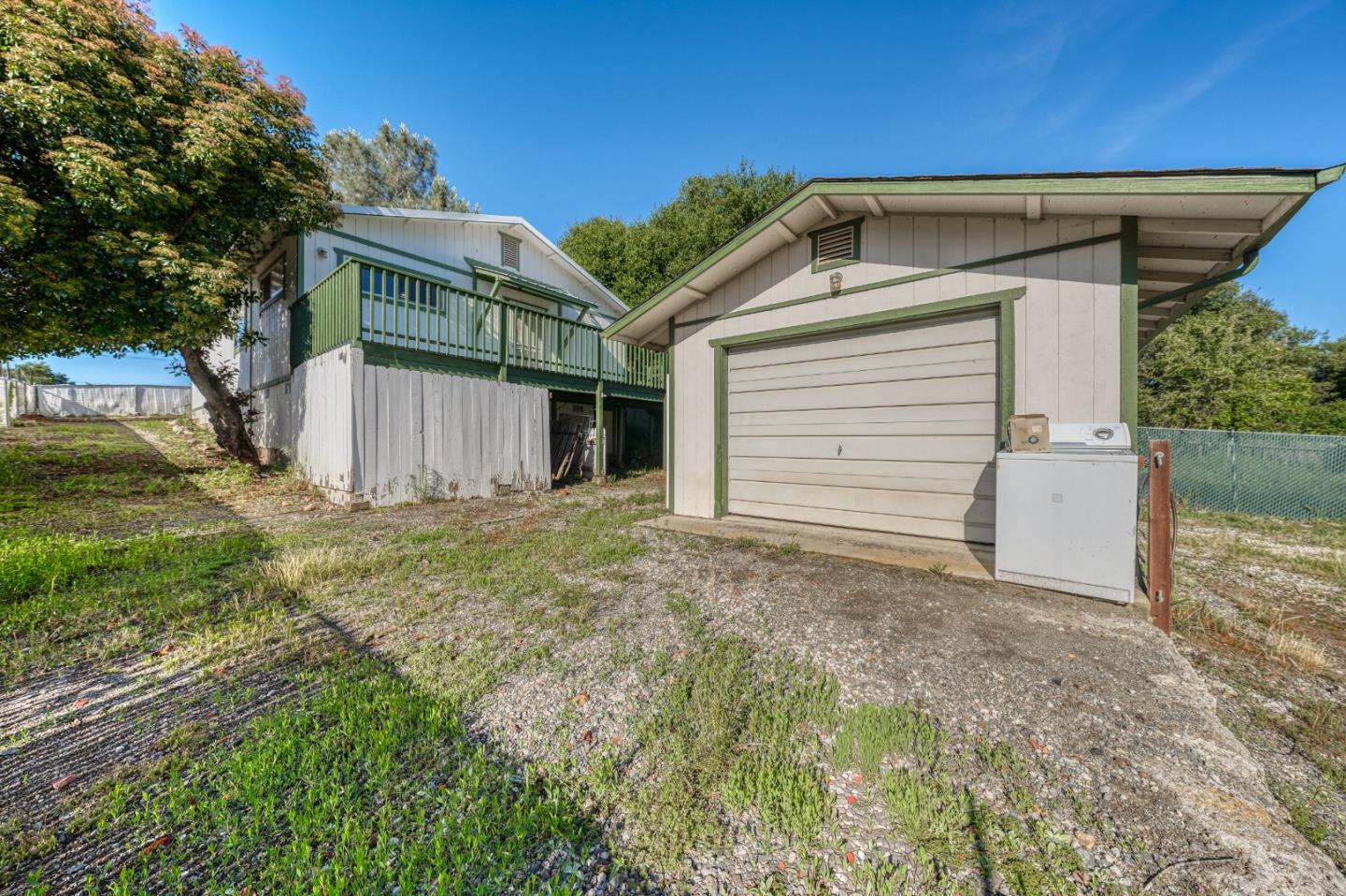 13590 Fair Oak Road Clearlake, CA 95422 - Photo 22 of 27 a view of a house with backyard and garage