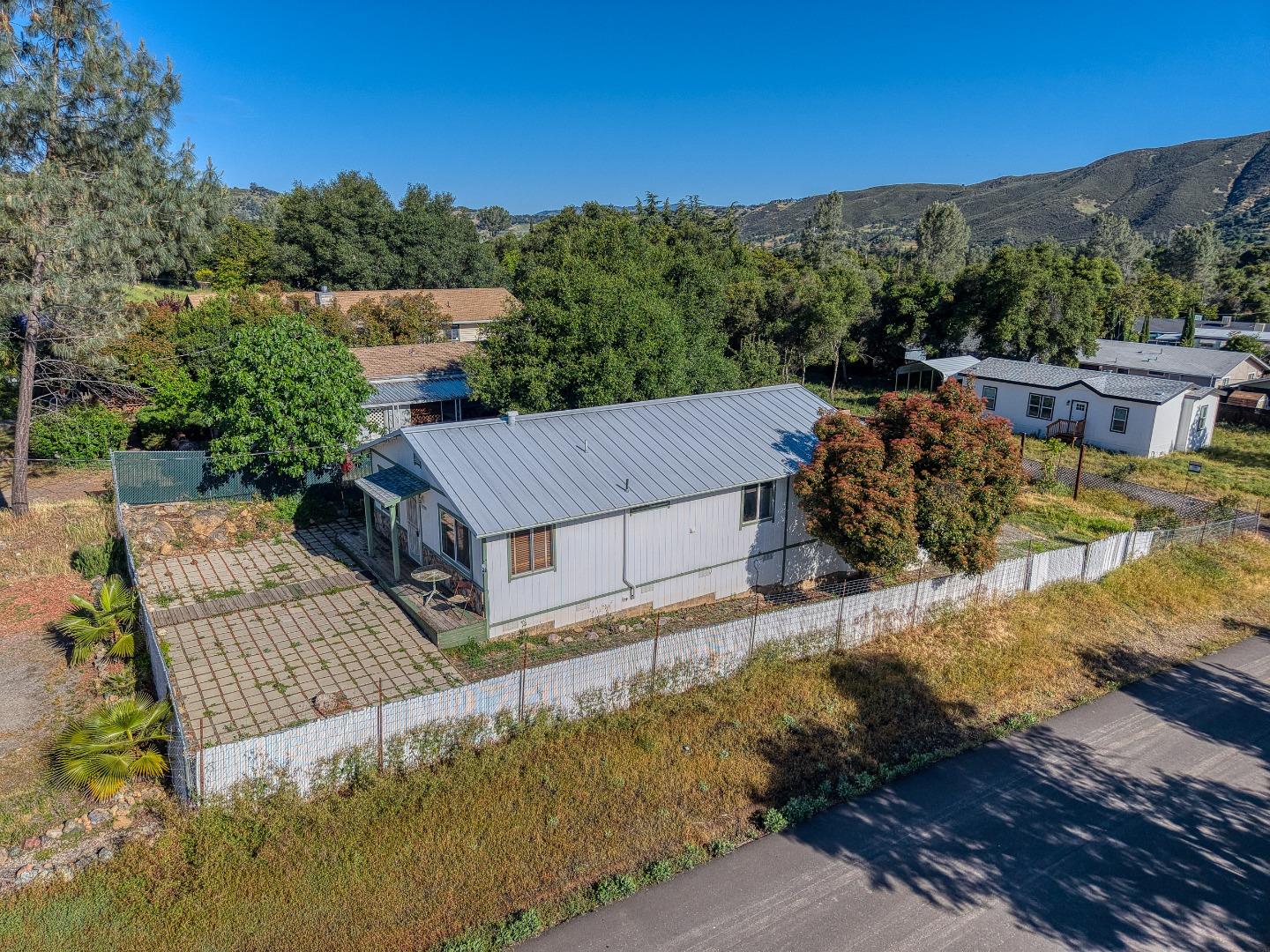 13590 Fair Oak Road Clearlake, CA 95422 - Photo 23 of 27 an aerial view of a house with a yard