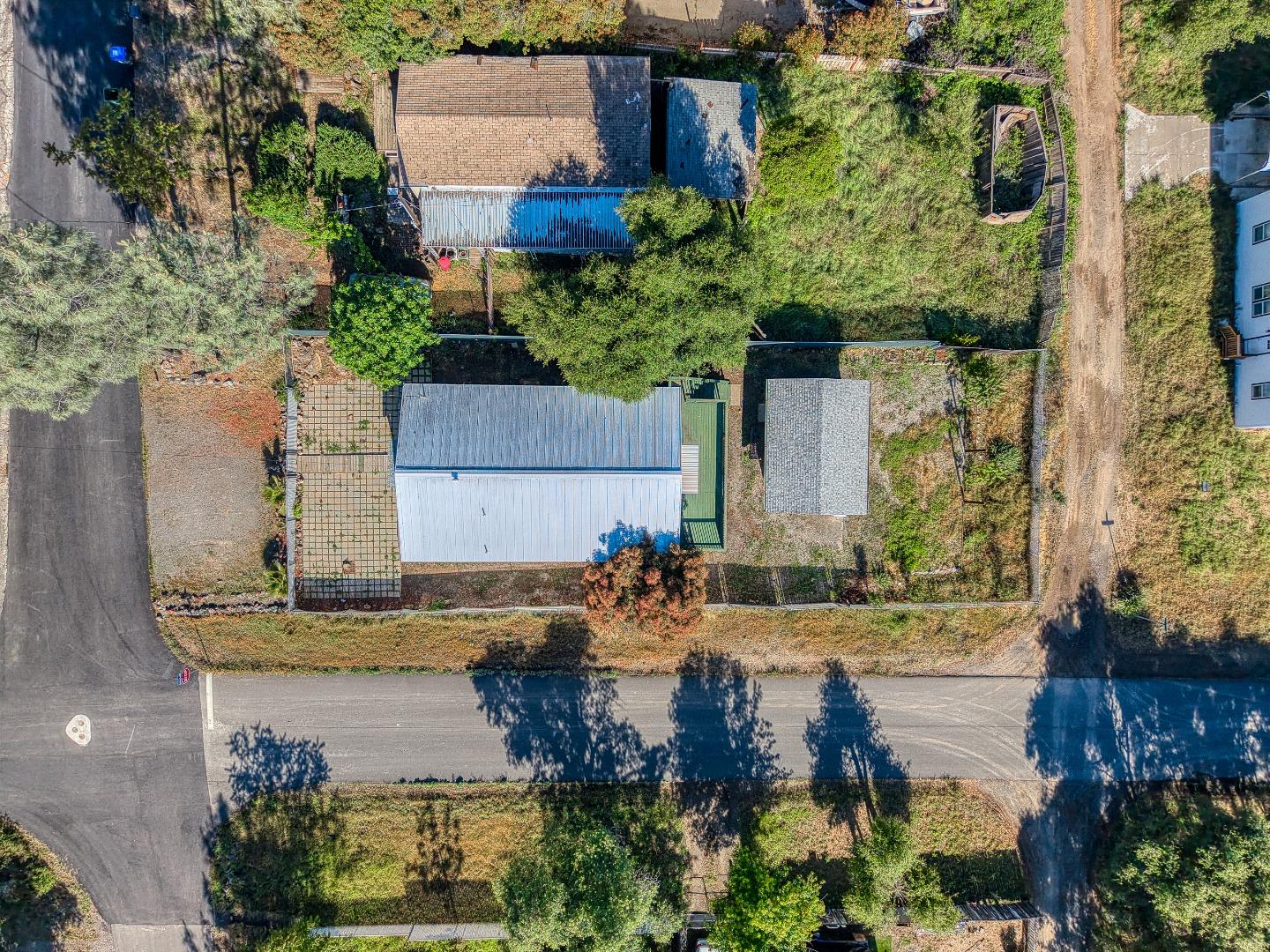 13590 Fair Oak Road Clearlake, CA 95422 - Photo 25 of 27 an aerial view of a house with a garden and swimming pool