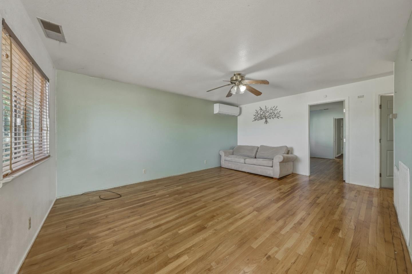 13590 Fair Oak Road Clearlake, CA 95422 - Photo 3 of 27 a view of a livingroom with wooden floor chandelier and a window