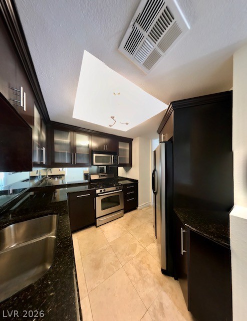 270 East Flamingo Road, Unit 336 Las Vegas, NV 89169 - Photo 2 of 11 This modern kitchen features sleek dark cabinetry and stainless steel appliances.