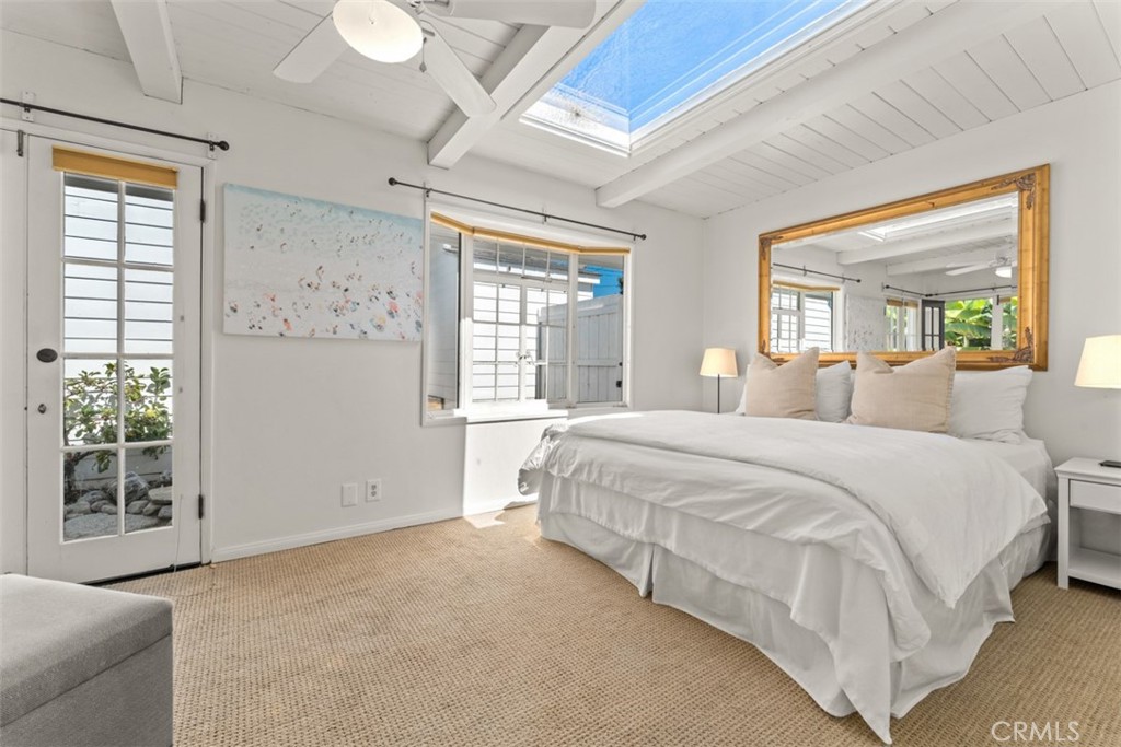 500 Mountain Road Laguna Beach, CA 92651 - Photo 19 of 36 a spacious bedroom with a large bed and a window