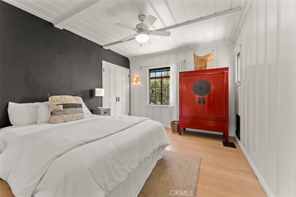 500 Mountain Road Laguna Beach, CA 92651 - Photo 22 of 36 a bedroom with a bed and a chandelier