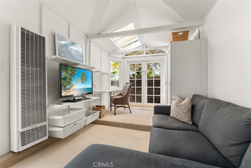 500 Mountain Road Laguna Beach, CA 92651 - Photo 29 of 36 a living room with furniture tv and a large window