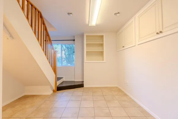 a view of a storage & utility room with washing machine