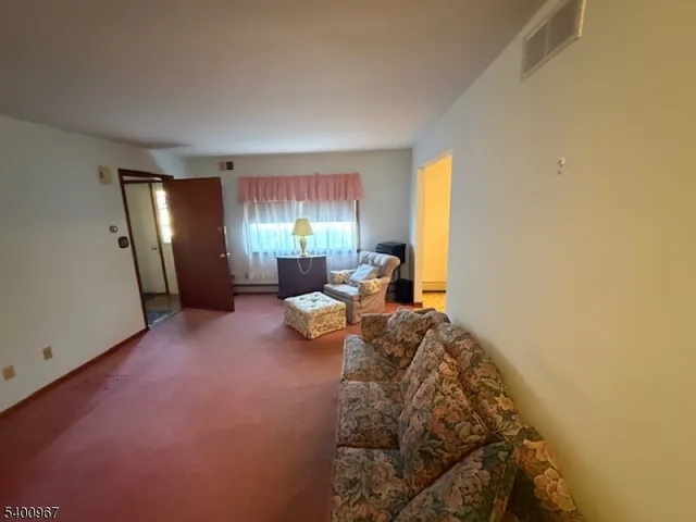 a bed room with a bed and a large window