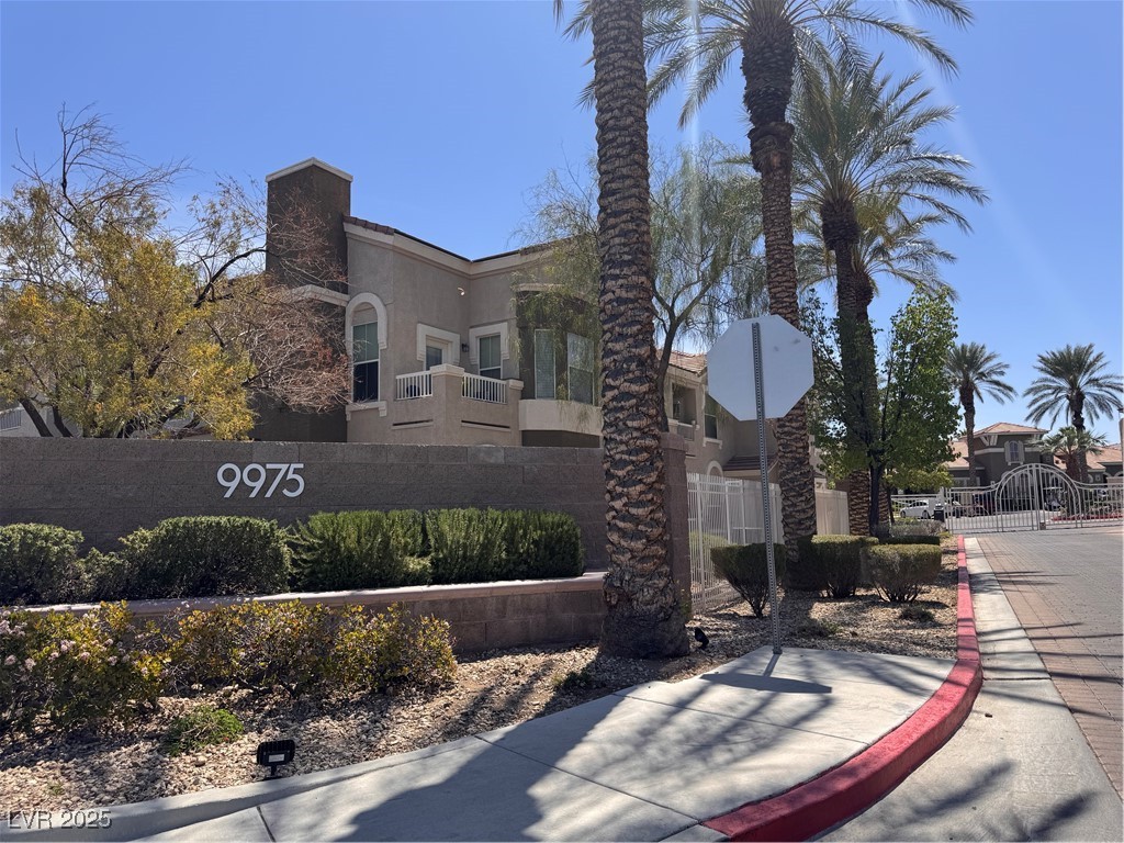 9975 Peace Way, Unit 1140 Las Vegas, NV 89147 - Photo 19 of 23 Community sign featuring a gate