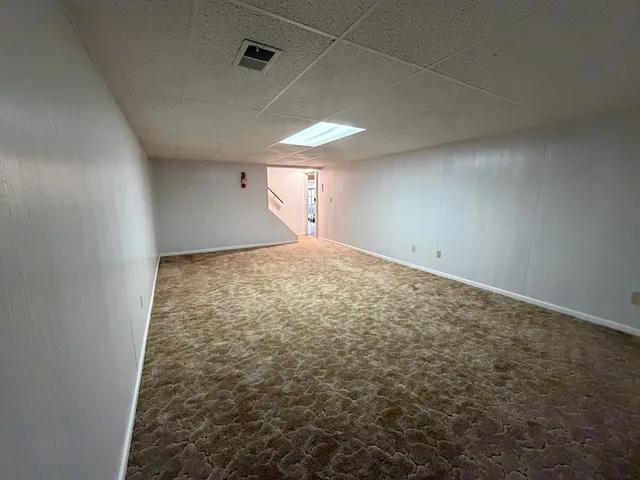 a view of workspace with furniture and window