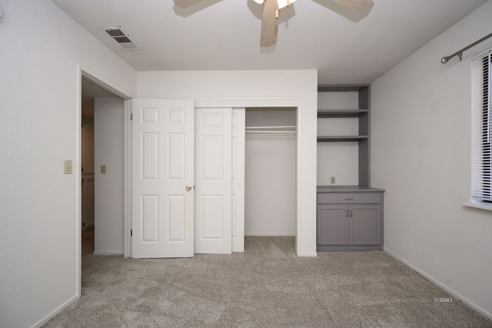 704 Beth Lane Ridgecrest, CA 93555 - Photo 23 of 39 an empty room with chandelier fan