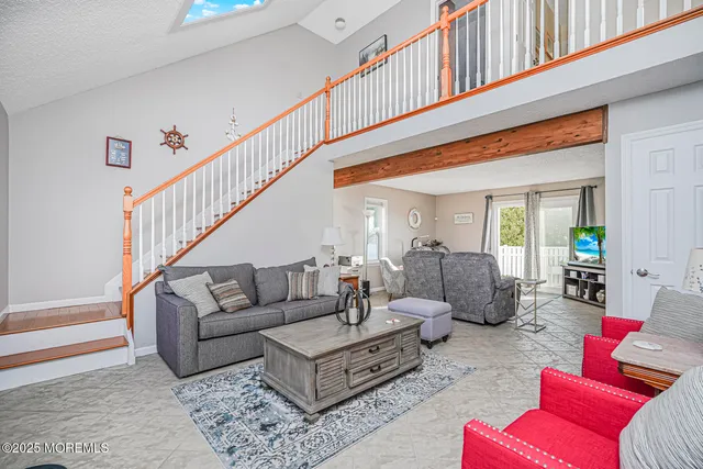 a view of entryway with wooden floor and stairs