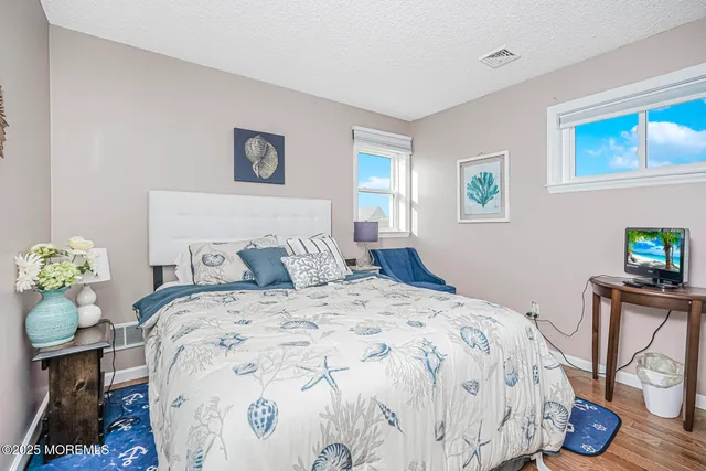 a bathroom with a granite countertop sink toilet a shower and a mirror