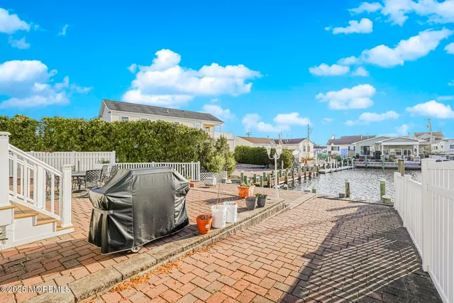 a living room with furniture ceiling fan and a rug