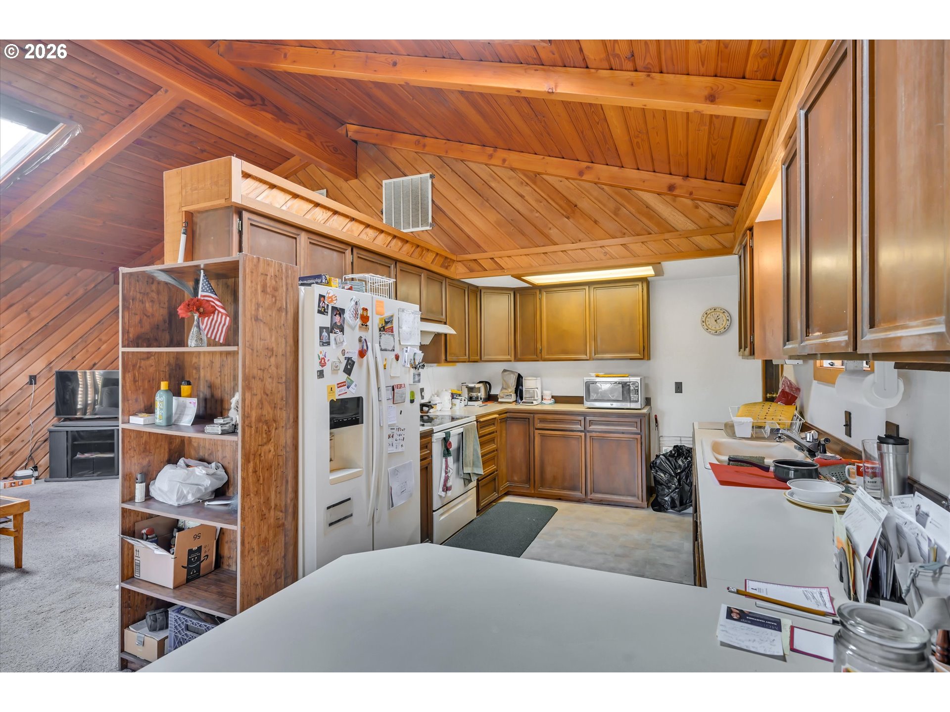 91 Godfrey Road Mossyrock, WA 98564 - Photo 12 of 47 a kitchen with a refrigerator and table