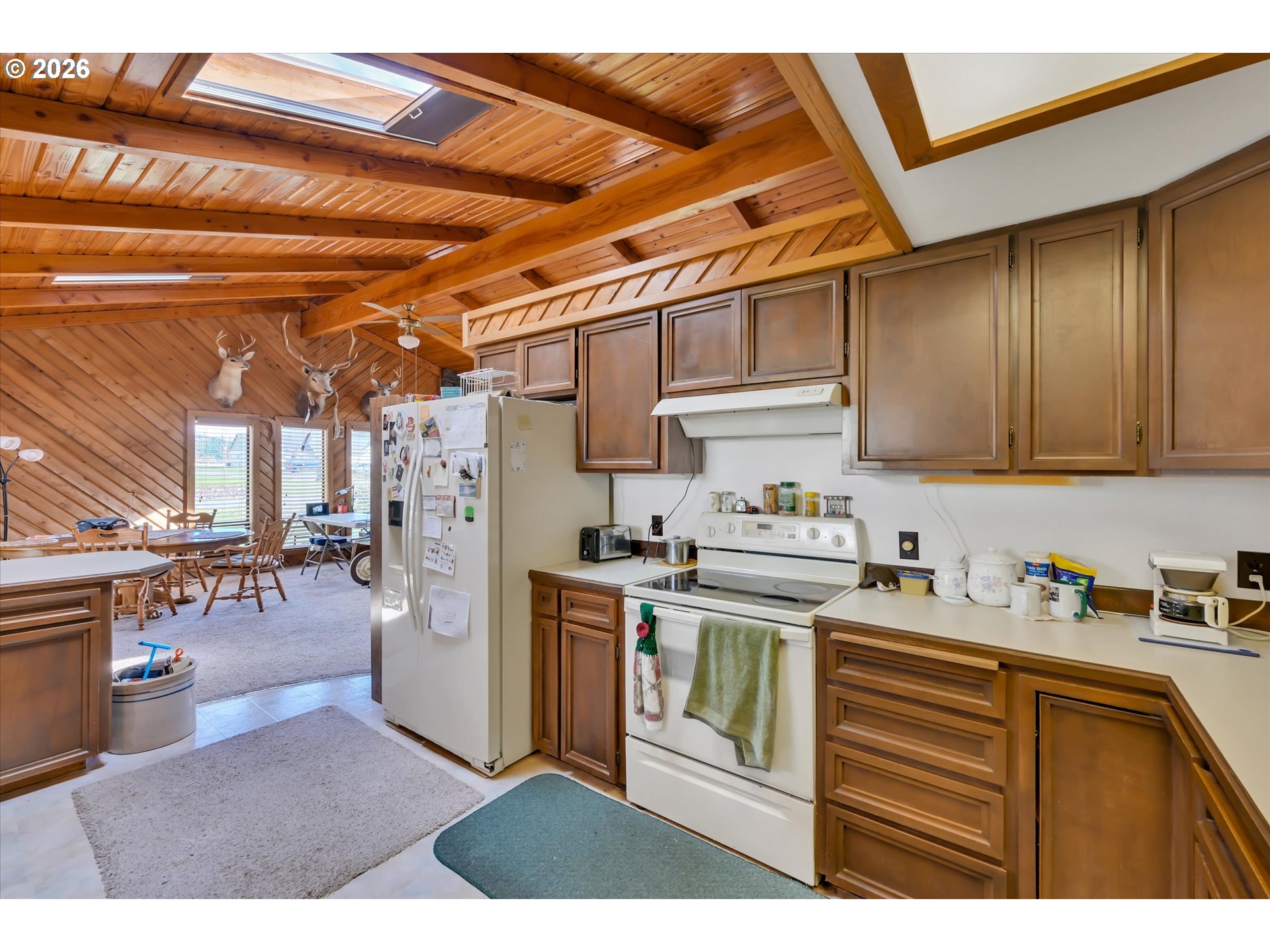 91 Godfrey Road Mossyrock, WA 98564 - Photo 14 of 47 a kitchen with a refrigerator and a stove top oven