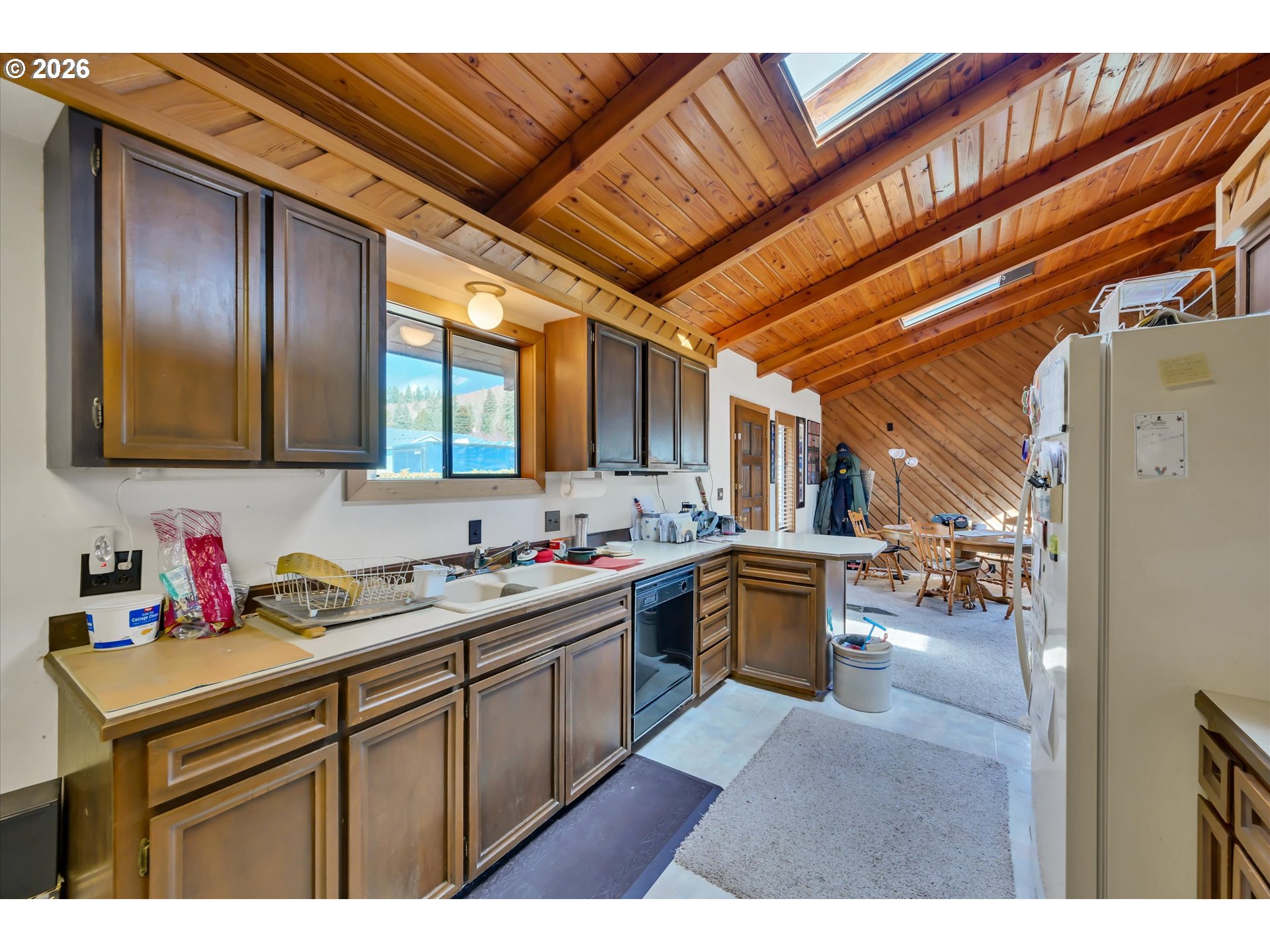 91 Godfrey Road Mossyrock, WA 98564 - Photo 15 of 47 a kitchen with a sink cabinets and wooden floor