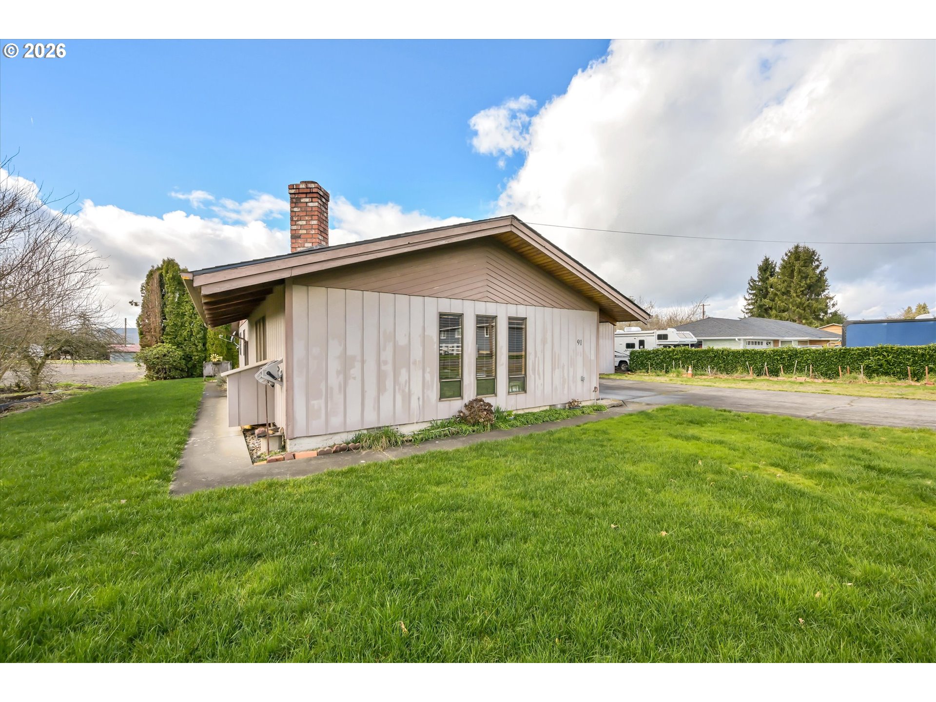 91 Godfrey Road Mossyrock, WA 98564 - Photo 28 of 47 a front view of a house with a garden and yard