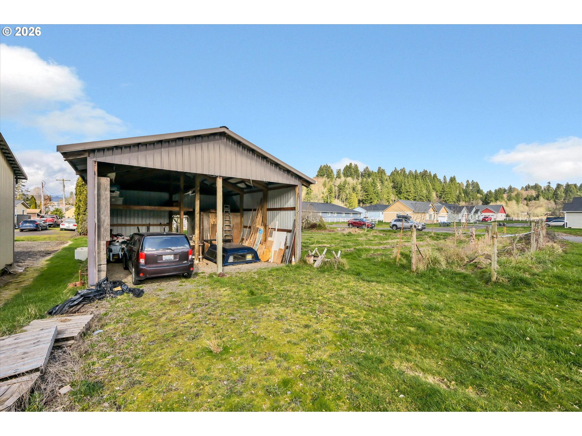 91 Godfrey Road Mossyrock, WA 98564 - Photo 34 of 47 a view of a house with a yard and sitting area
