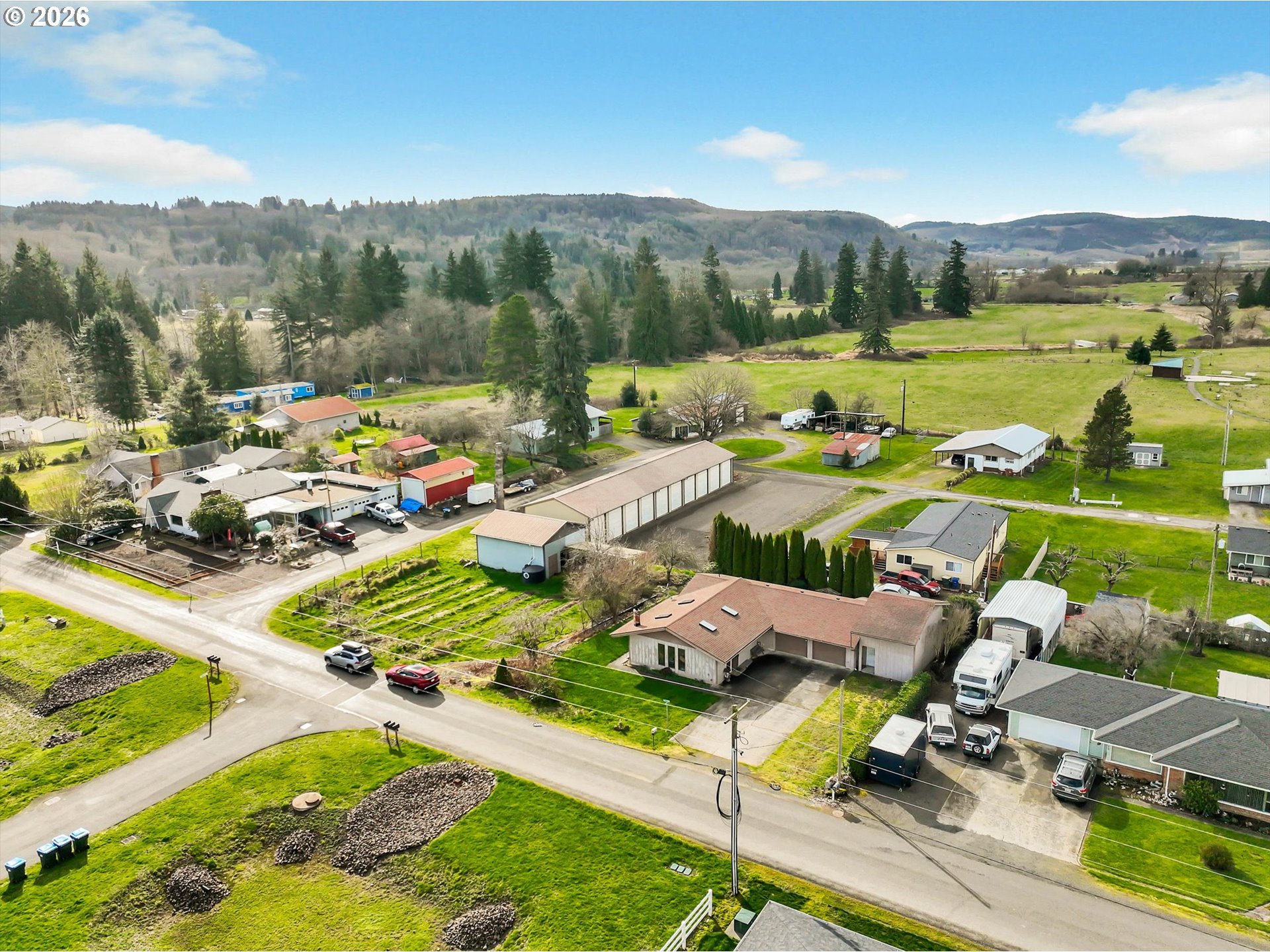 91 Godfrey Road Mossyrock, WA 98564 - Photo 41 of 47 a view of a lake with a yard and a patio