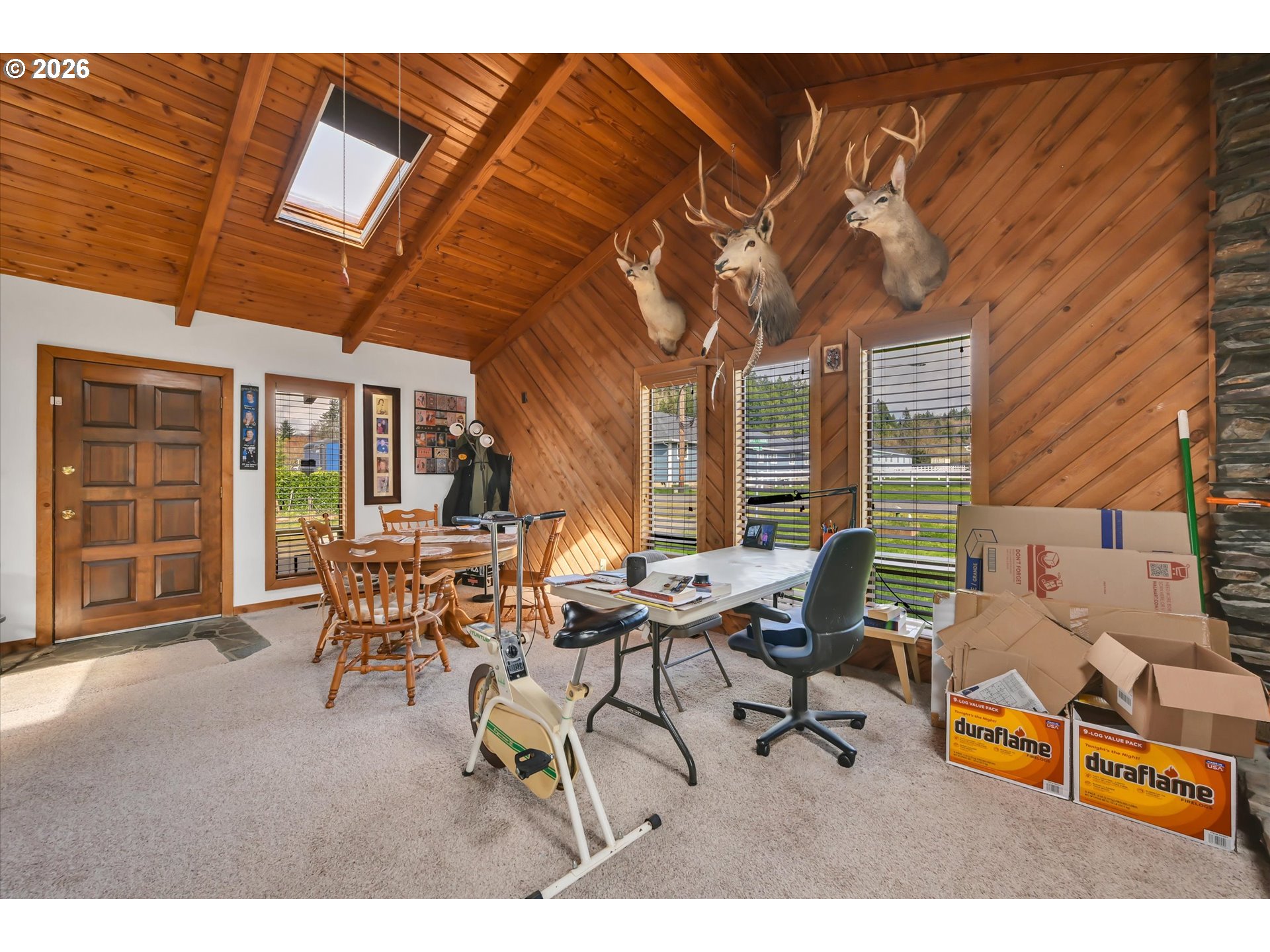 91 Godfrey Road Mossyrock, WA 98564 - Photo 7 of 47 a living room with furniture a fireplace and large windows