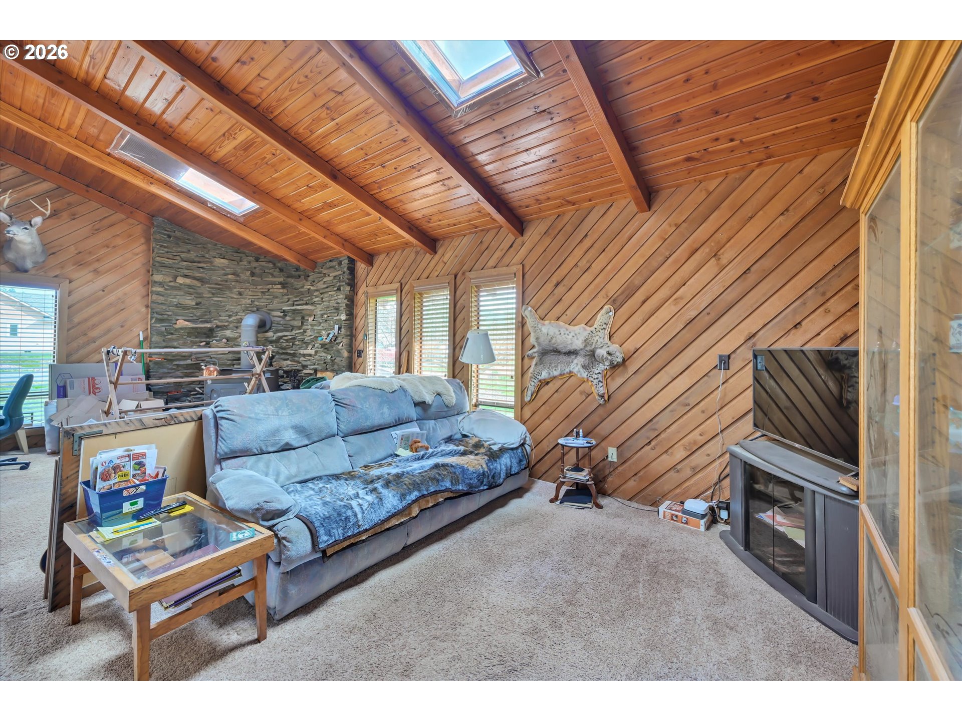 91 Godfrey Road Mossyrock, WA 98564 - Photo 10 of 47 a living room with furniture and a fireplace