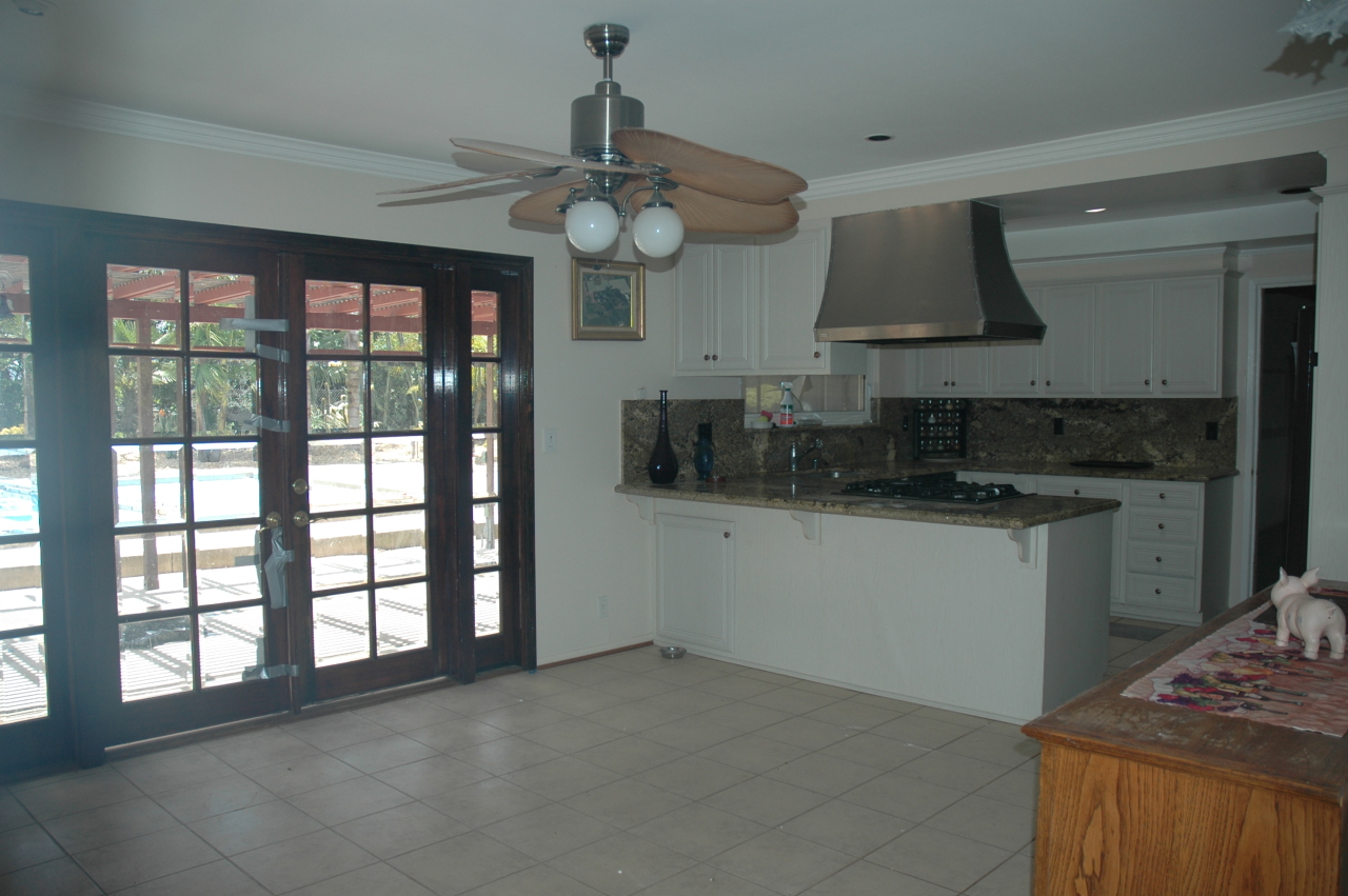 224 Serpolla Drive Carpinteria, CA 93013 - Photo 4 of 11 a kitchen with stainless steel appliances granite countertop a stove and a sink with cabinets