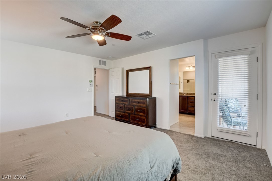 484 Filaree Place Henderson, NV 89015 - Photo 44 of 71 This spacious bedroom offers comfortable living with direct access to a private outdoor space.