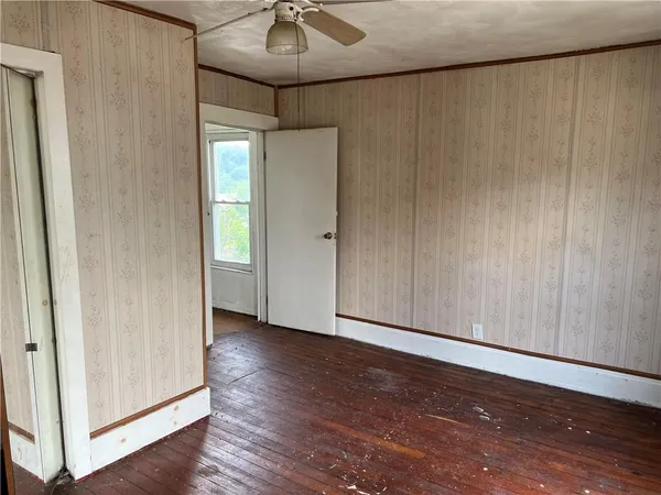 a view of entryway with wooden floor