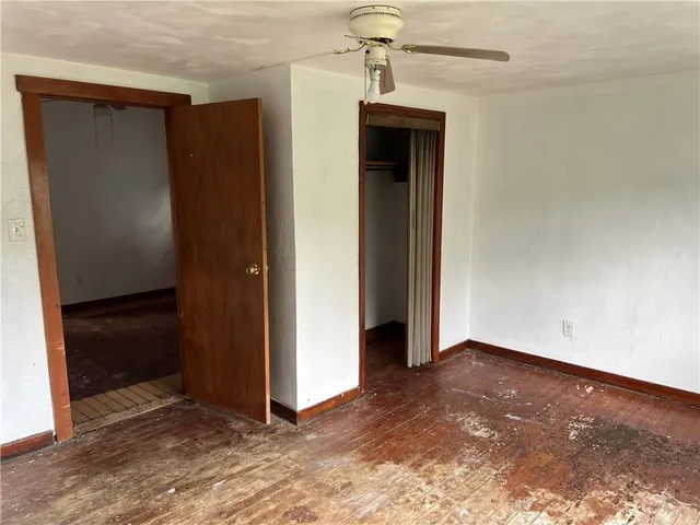 a view of a small space with wooden floor
