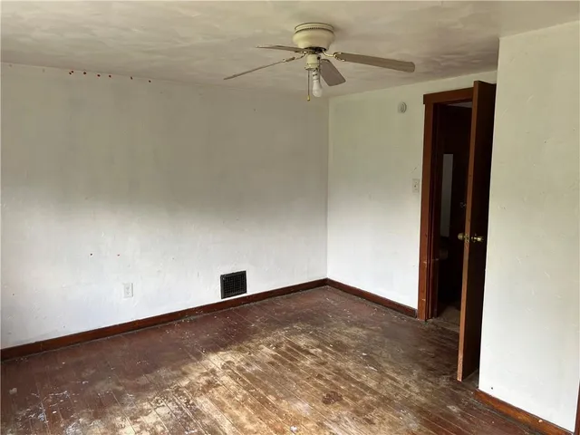 a view of house with backyard