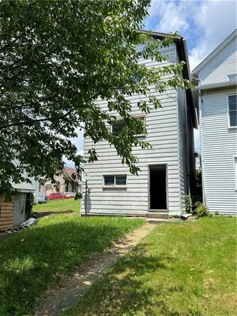 a view of yard with swimming pool and trees