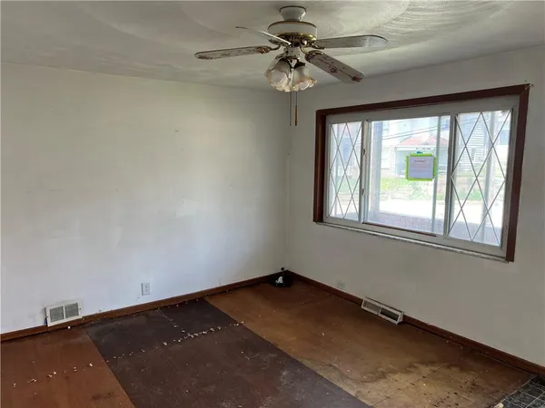 a view of a big room with windows