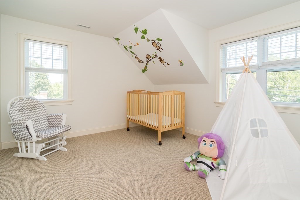 10 Farrant Road Natick, MA 01760 - Photo 12 of 31 a view of livingroom with furniture and a window
