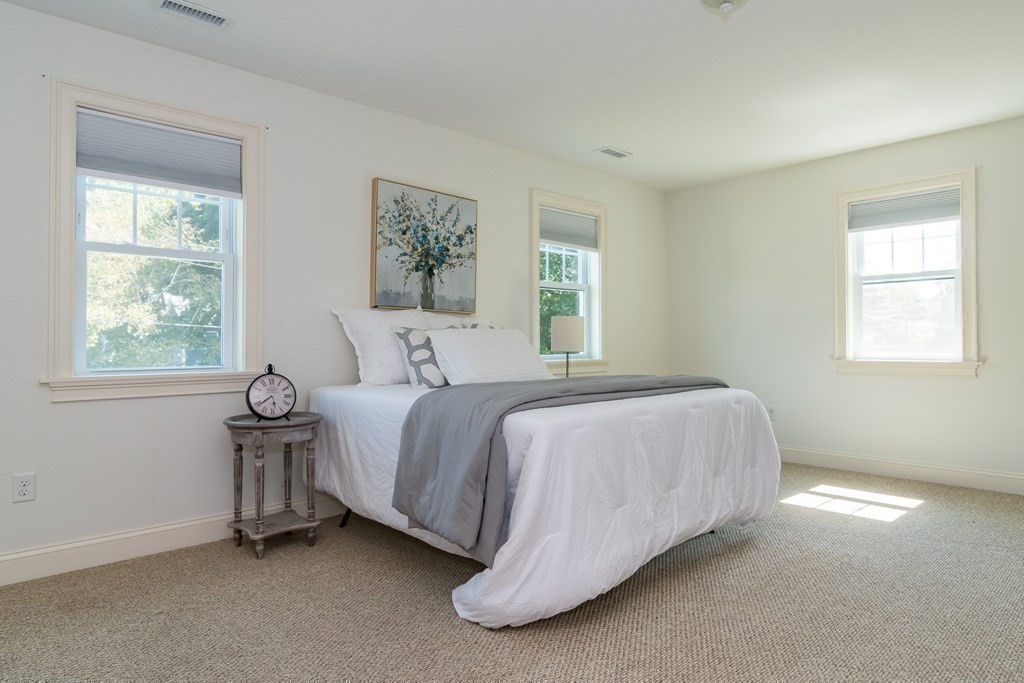 10 Farrant Road Natick, MA 01760 - Photo 16 of 31 a spacious bedroom with a bed and a window