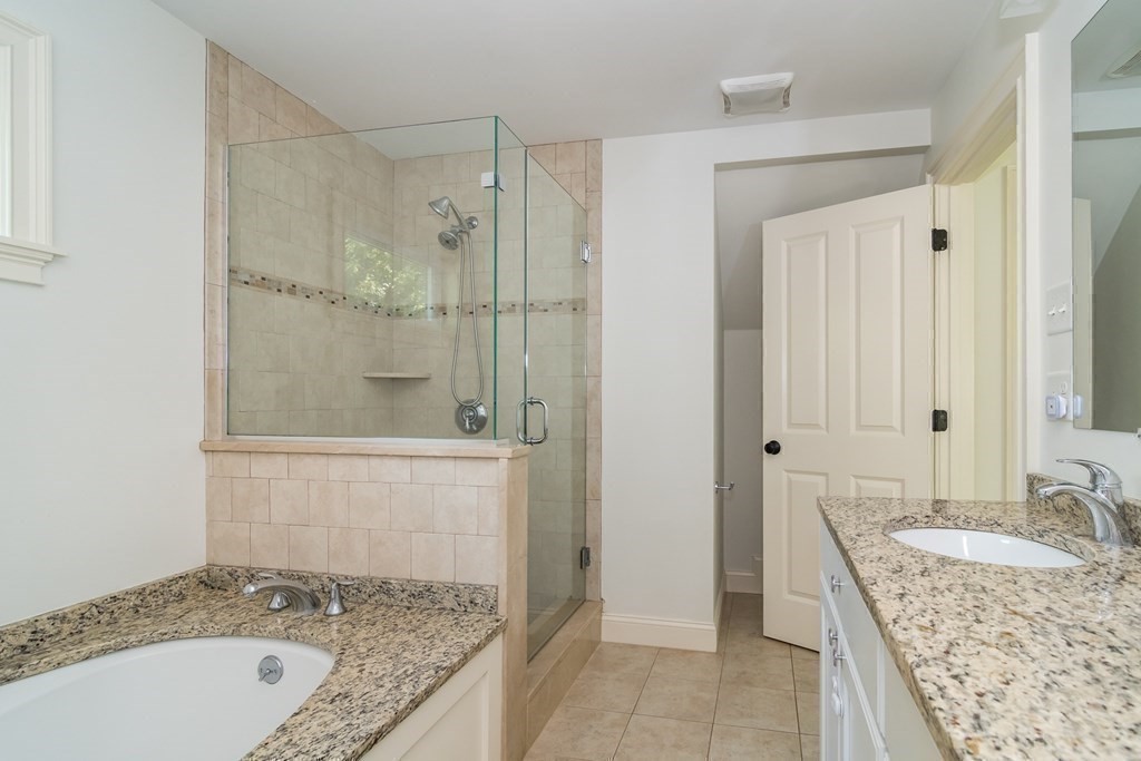 10 Farrant Road Natick, MA 01760 - Photo 18 of 31 a bathroom with a granite countertop sink and shower