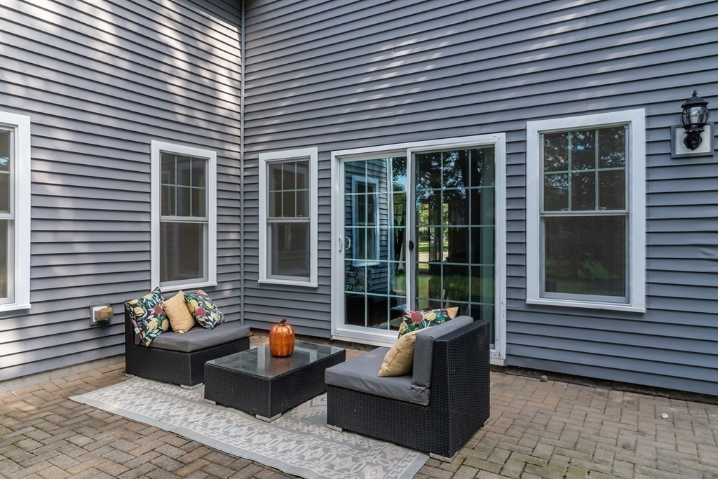 10 Farrant Road Natick, MA 01760 - Photo 24 of 31 a balcony with furniture and a potted plant
