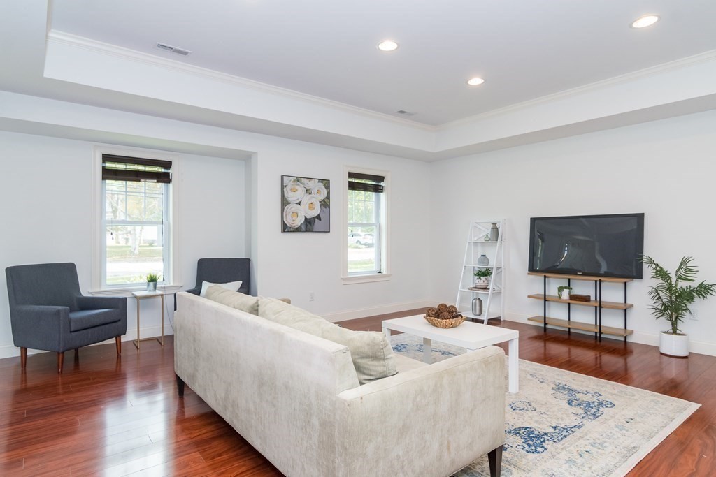10 Farrant Road Natick, MA 01760 - Photo 4 of 31 a living room with furniture and a flat screen tv