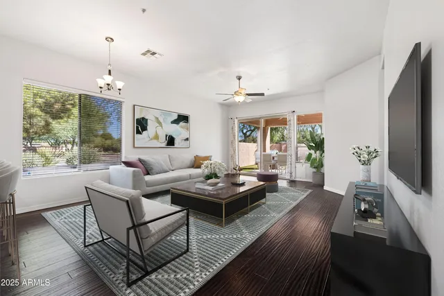 a living room with furniture and a flat screen tv