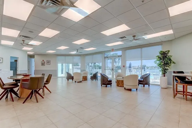a group of people sitting at tables in a room