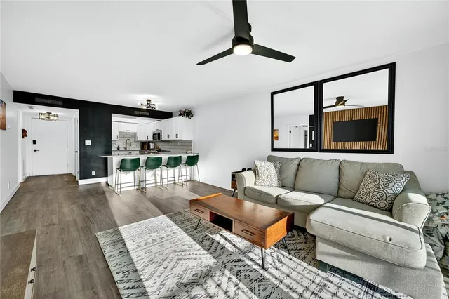 a living room with furniture and a rug