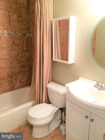 a bathroom with a toilet a sink and a bathtub