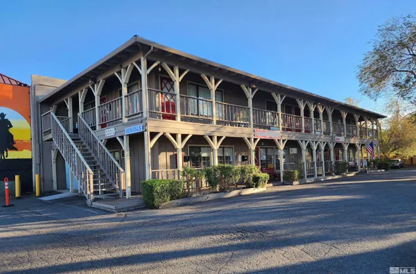 a front view of a house with a street