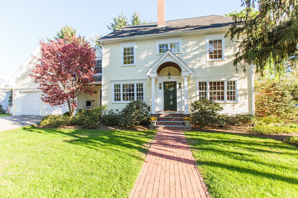 18 Thomas Road Wellesley, MA 02482 - Photo 1 of 24 a front view of a house with a yard