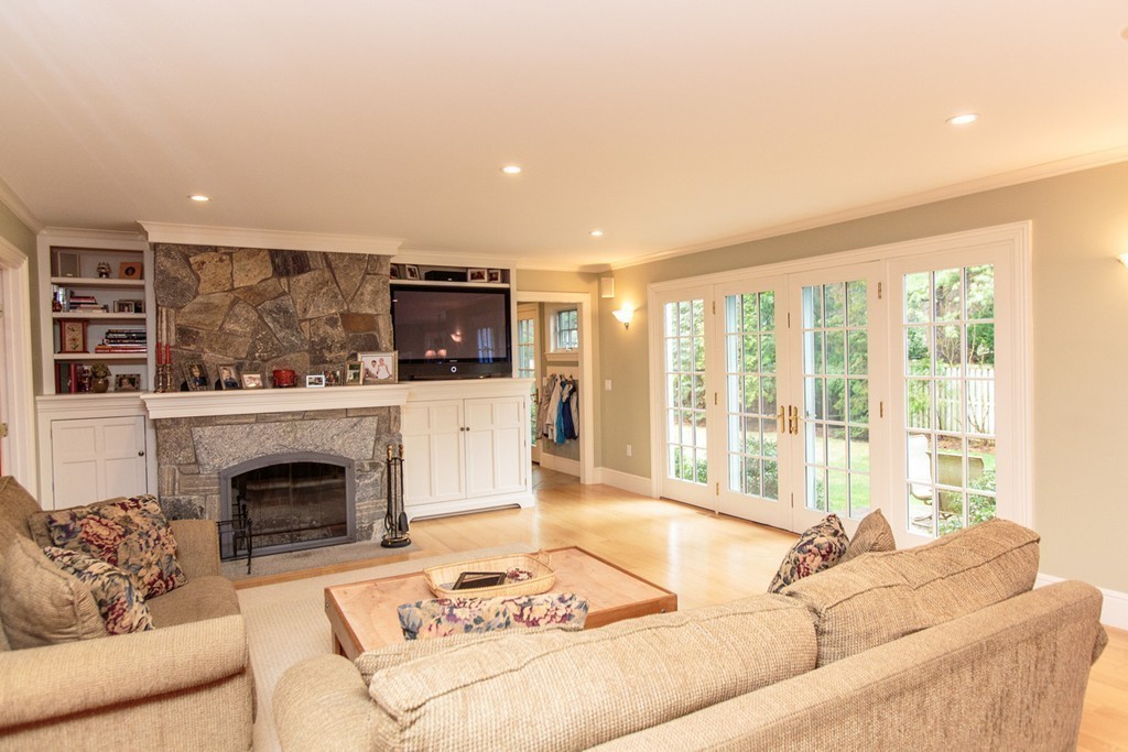 18 Thomas Road Wellesley, MA 02482 - Photo 12 of 24 a living room with furniture and a fireplace